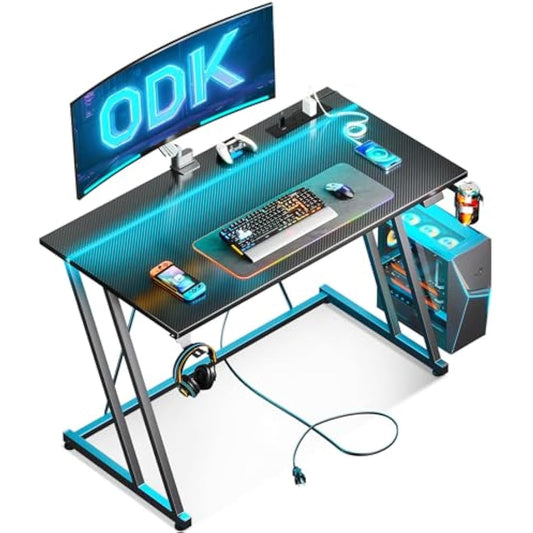 ODK Gaming Desk with LED Lights & Power Outlet, Gaming Table with Cup Holder and Headphone Hook, Double Z Frame Design Computer Desk, Carbon Fiber Black 100 cm