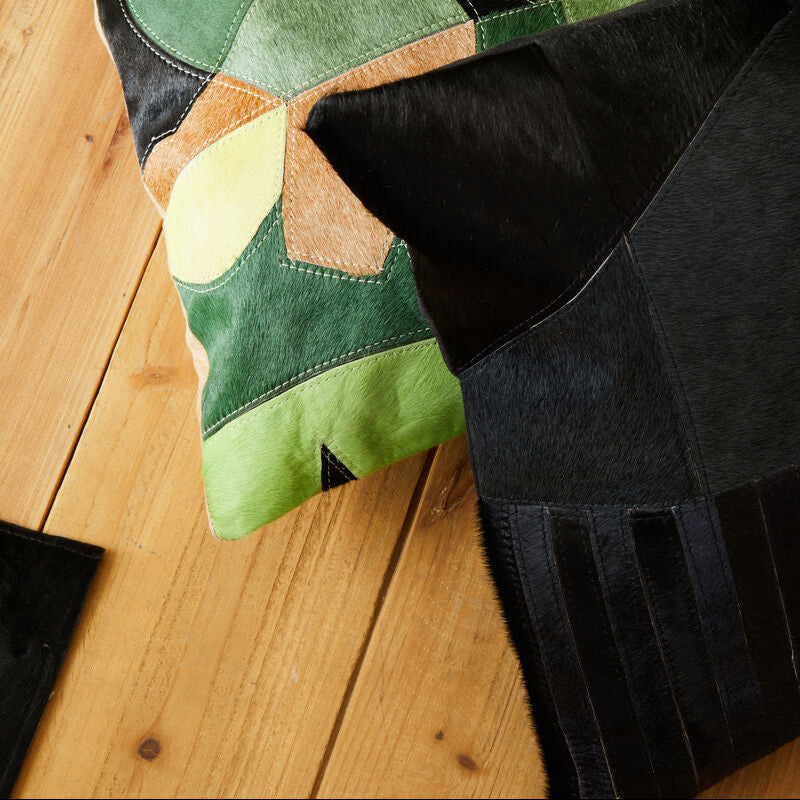 Bosie Safira Black And Grey Hair on Leather Cushion