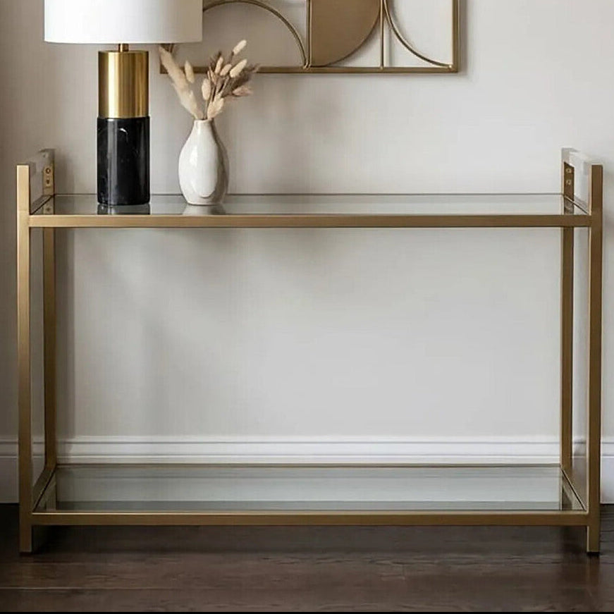 Matte Gold Stainless Steel Console Table with Clear Glass Top and Shelf | Vogue