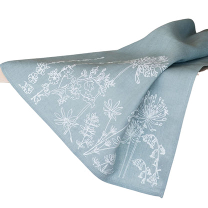 Helen Round Linen Tea Towel, duck egg blue. This beautiful, hand printed towel features garden flowers. Machine Washable at 40 degrees and will