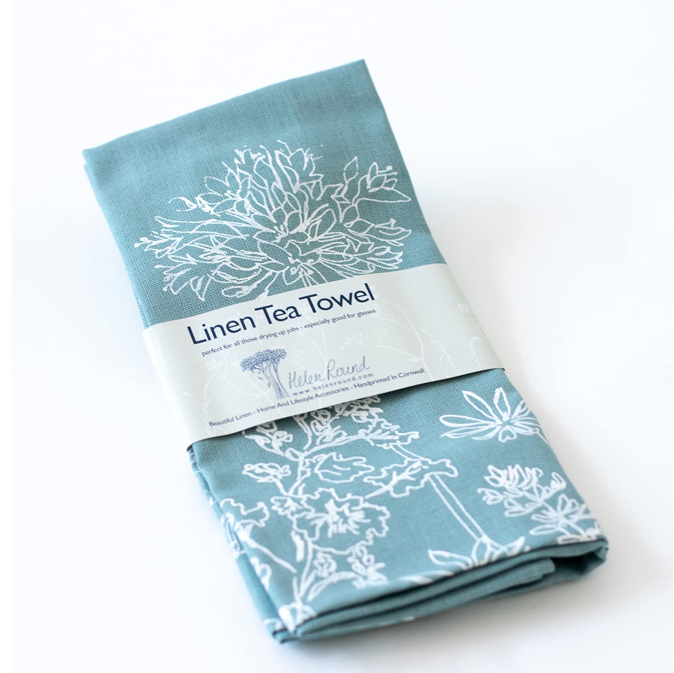 Helen Round Linen Tea Towel, duck egg blue. This beautiful, hand printed towel features garden flowers. Machine Washable at 40 degrees and will