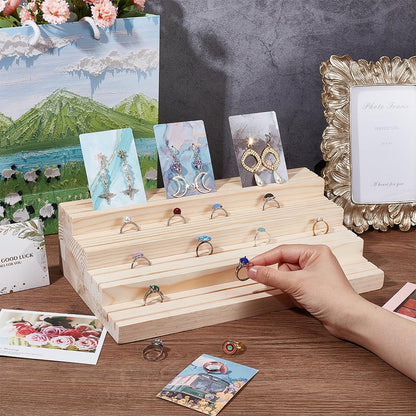 NBEADS 4-Tier Wood Jewelry Display Stand, Wooden Earring Organizer Holder with Grooves Jewelry Showcase Rack for Rings Earring Display Cards Photo