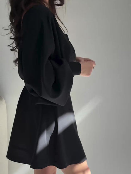 Black Two-Piece Set With Textured Strapless Top And Flared Mini Skirt